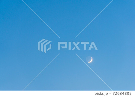 Crescent Moon and Earthshine in Blue Sky Crescent Moon and Earthshine in Blue Sky 72634805