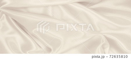 Smooth elegant golden silk or satin luxury cloth texture as wedding background. Luxurious background design. In Sepia toned. Retro style Smooth elegant golden silk or satin luxury cloth texture as wedding background. Luxurious background design. In Sepia toned. Retro style 72635810
