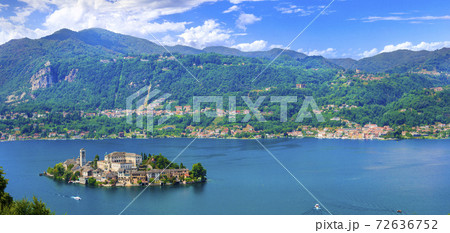 Beautiful lakes of Italy - lago d'Orta (Orta San Giulio ) and small pictorial island with monastery and village . Piedmont 72636752