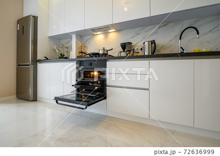 White kitchen in classic style, front view 72636999