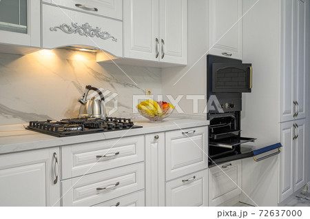 White kitchen in classic style, front view White kitchen in classic style, front view 72637000