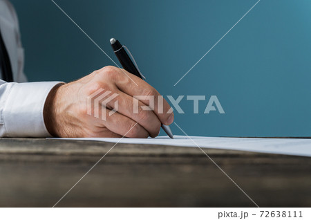 Businessman or lawyer signing a document 72638111