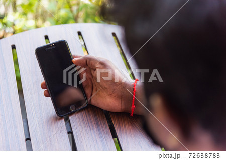 black businessman person holding a modern digital smart phone blank screen black businessman person holding a modern digital smart phone blank screen 72638783