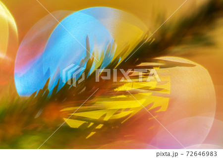 Beautiful Xmas ornament decorations, defocused creative abstract blurred bokeh. Silhouette of pine branch with needles Christmas tree 72646983