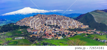 Amazing village Gangi with Etna volcano behind in Sicily, Italy 72654381