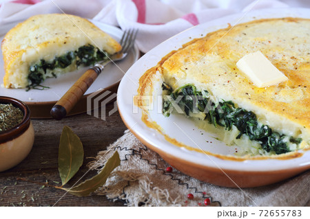 Moussaka. Potato casserole (gratin) with spinach. Greek cuisine 72655783