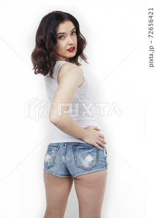 young pretty stylish hipster girl posing emotional isolated on white background happy smiling cool smile, lifestyle people concept 72656421