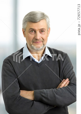 Confident mature man with crossed arms. Confident mature man with crossed arms. 72657713