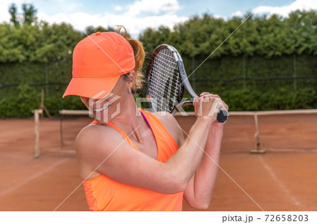 young attractive tennis player on the court 72658203