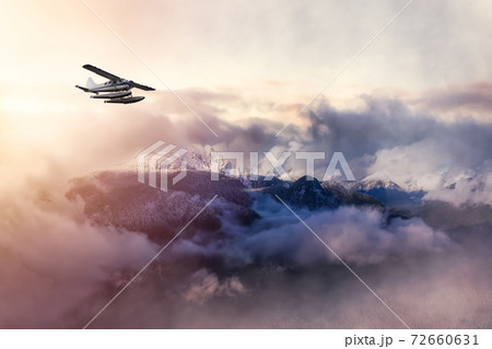 Airplane flying near the Beautiful Canadian Mountain Nature Landscap 72660631