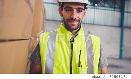 Professional industry worker close up portrait in the factory or warehouse Professional industry worker close up portrait in the factory or warehouse 72663174