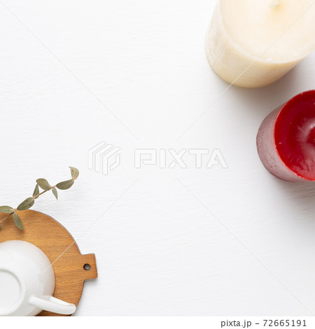 Empty mug cup with candles on white background. top view, copy space 72665191