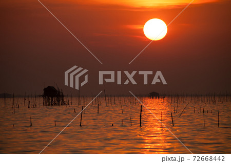 boats are floating under colorful sky at sunset time boats are floating under colorful sky at sunset time 72668442