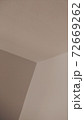Beige background of a wall angle, or some geometrical figures. 72669262