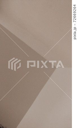 Beige background of a wall angle, or some geometrical figures. 72669264