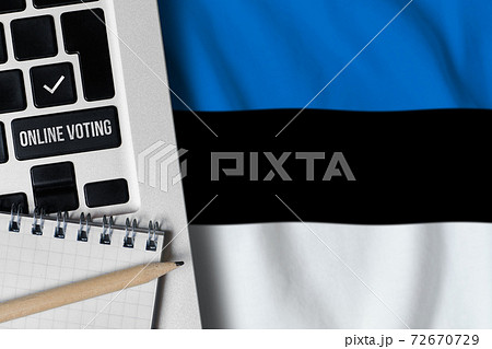 Online voting concept Republic of Estonia. Keyboard near country flag. 72670729