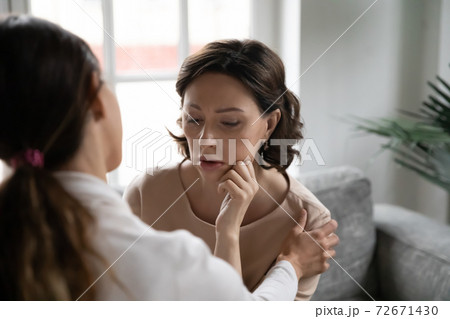 Close up caring grownup daughter comforting upset mature mother 72671430