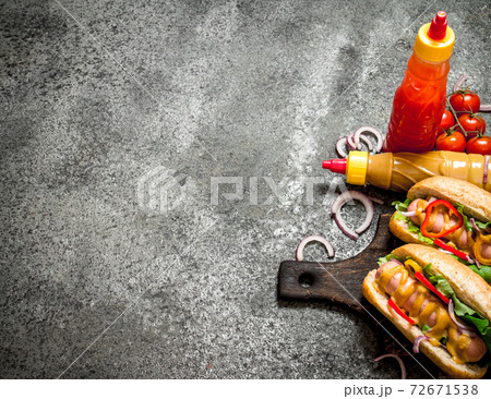 Street food. Hot dogs with vegetables and herbs. 72671538
