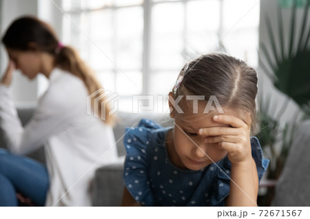 Close up upset little girl and mother ignoring each other Close up upset little girl and mother ignoring each other 72671567
