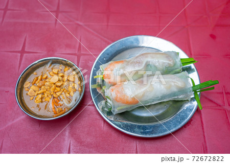 Vietnamese classic fresh spring rolls served with peanut sauce 72672822