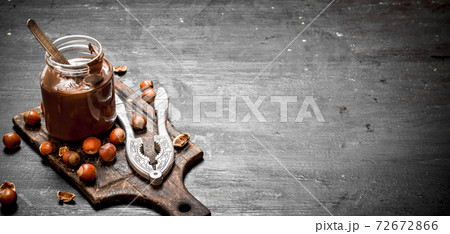 Chocolate butter with hazelnuts. 72672866