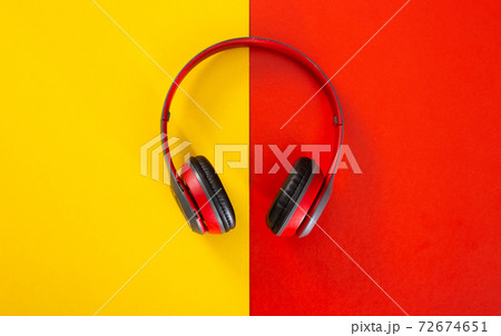 headphones on red and yellow background. headphones on red and yellow background. 72674651