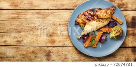 Roasted partridge with pumpkin Roasted partridge with pumpkin 72674731