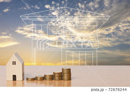 Money coin saving with a wooden home model on evening sky background. 72676244