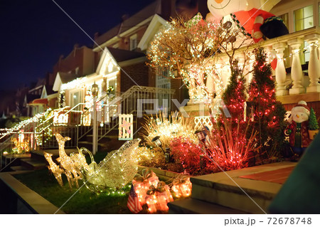 A street decorated for Christmas and New Year holidays in the Dyker Heights neighborhood, New York 72678748