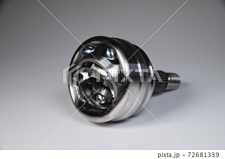 New CV joint on a gray background. Car suspension parts New CV joint on a gray background. Car suspension parts 72681339