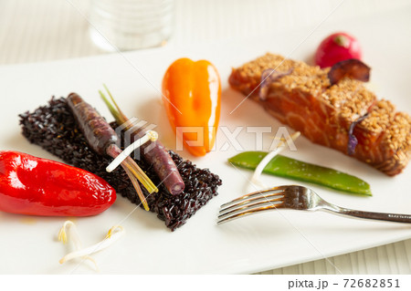 Salmon with black rice and vegetables Salmon with black rice and vegetables 72682851