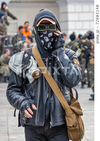 Stalker soldier with gas mask and leather jacket walking 72683148