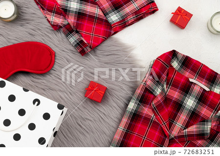 Womens sleapwear and accessories on gray fluffy bedspread Womens sleapwear and accessories on gray fluffy bedspread 72683251
