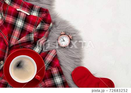 Womens sleapwear and accessories on gray fluffy bedspread Womens sleapwear and accessories on gray fluffy bedspread 72683252