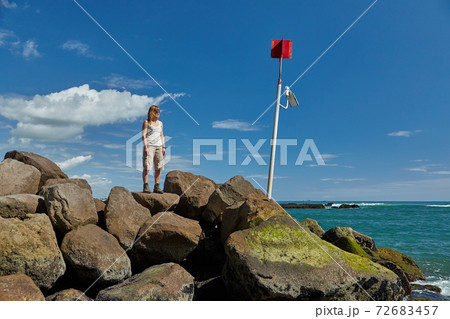 Woman enjoying seaside view 72683457