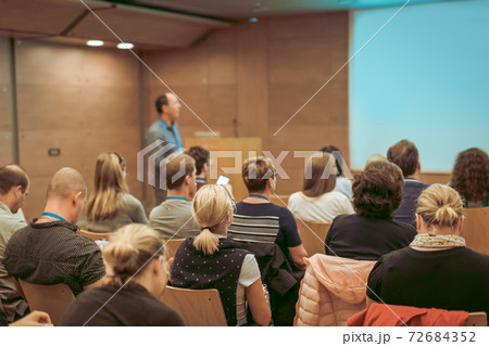 Audience in lecture hall on scientific conference. Audience in lecture hall on scientific conference. 72684352