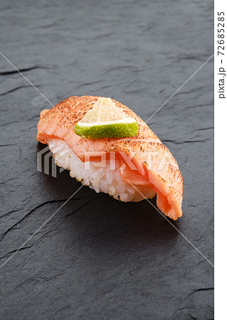 Sushi with seared salmon on slate plate Sushi with seared salmon on slate plate 72685285