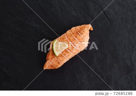 Sushi with seared salmon on slate plate Sushi with seared salmon on slate plate 72685286