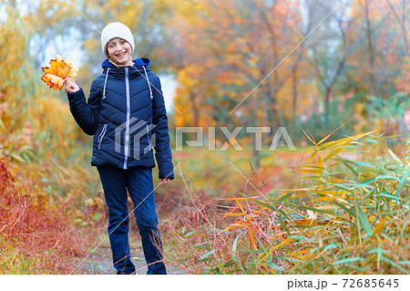 a girl posing near river and enjoys autumn, beautiful nature with yellow leaves a girl posing near river and enjoys autumn, beautiful nature with yellow leaves 72685645