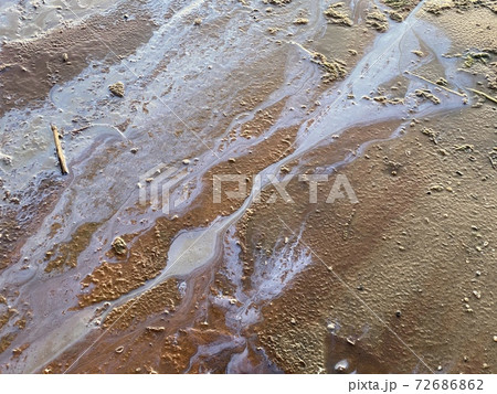 oil stains on beach sand environmental disaster 72686862