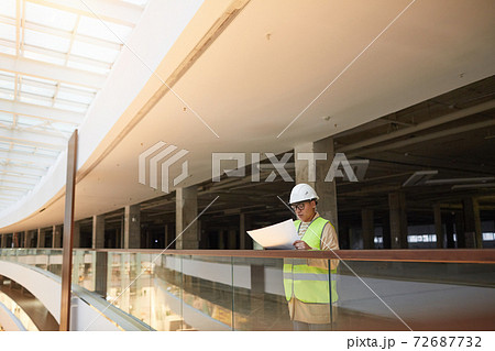 Female Engineer Inspecting Plans 72687732