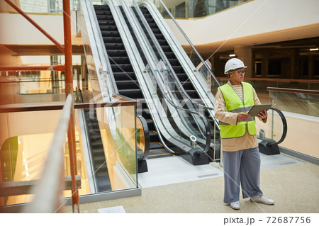 Female Worker Using Tablet on Construction Site 72687756