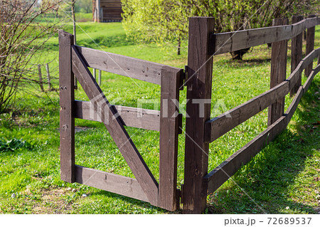 wooden gate entrance to the farm, open wooden gate wooden gate entrance to the farm, open wooden gate 72689537