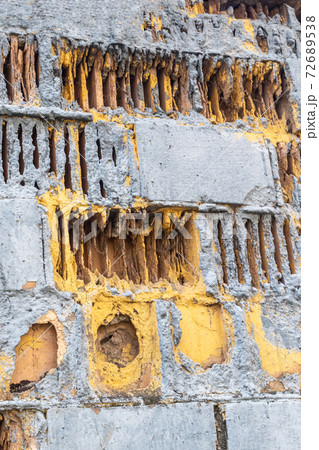 texture of an industrial old factory wall with destroyed and damaged bricks 72689538