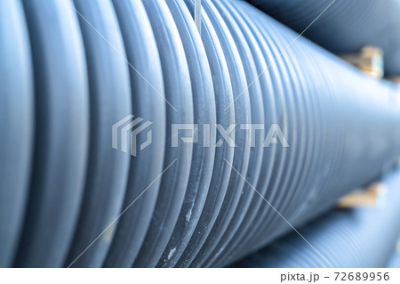 Close up view of shiny metal pipes at a construction site on a sunny day Close up view of shiny metal pipes at a construction site on a sunny day 72689956