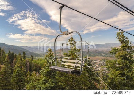 Chairlift overlooking the scenic Park City Utah landscape on a sunny summer day 72689972