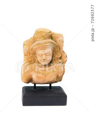 Small apsara statue on a wooden base as souvenir for tourists. 72692577