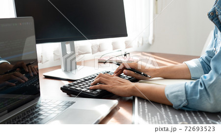 Software developer or programmer working data debugging improvement binary algorithm on desktop pc in a software develop company office. Software developer or programmer working data debugging improvement binary algorithm on desktop pc in a software develop company office. 72693523