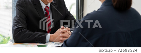 business professionals sitting around table meeting colleagues working together brainstorming on project discussing and planning concept at office business professionals sitting around table meeting colleagues working together brainstorming on project discussing and planning concept at office 72693524