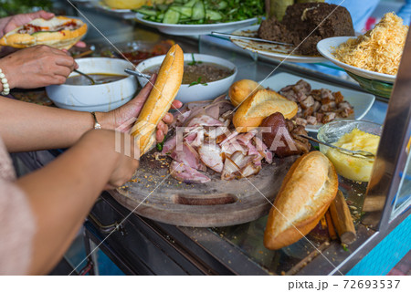 People making Banh Mi, Vietnamese famous local People making Banh Mi, Vietnamese famous local 72693537
